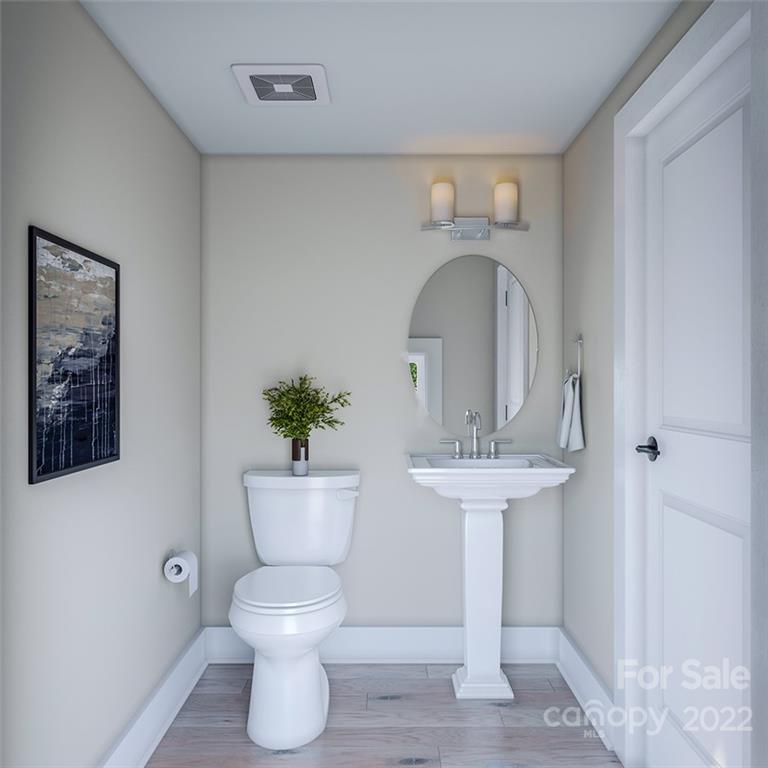 642 East Woodlawn Road Charlotte, NC 28209 - Photo 11 of 27 a view of living room with a sink and a mirror
