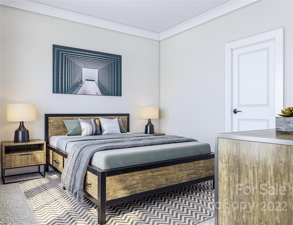 642 East Woodlawn Road Charlotte, NC 28209 - Photo 13 of 27 a bedroom with a bed and a night stand