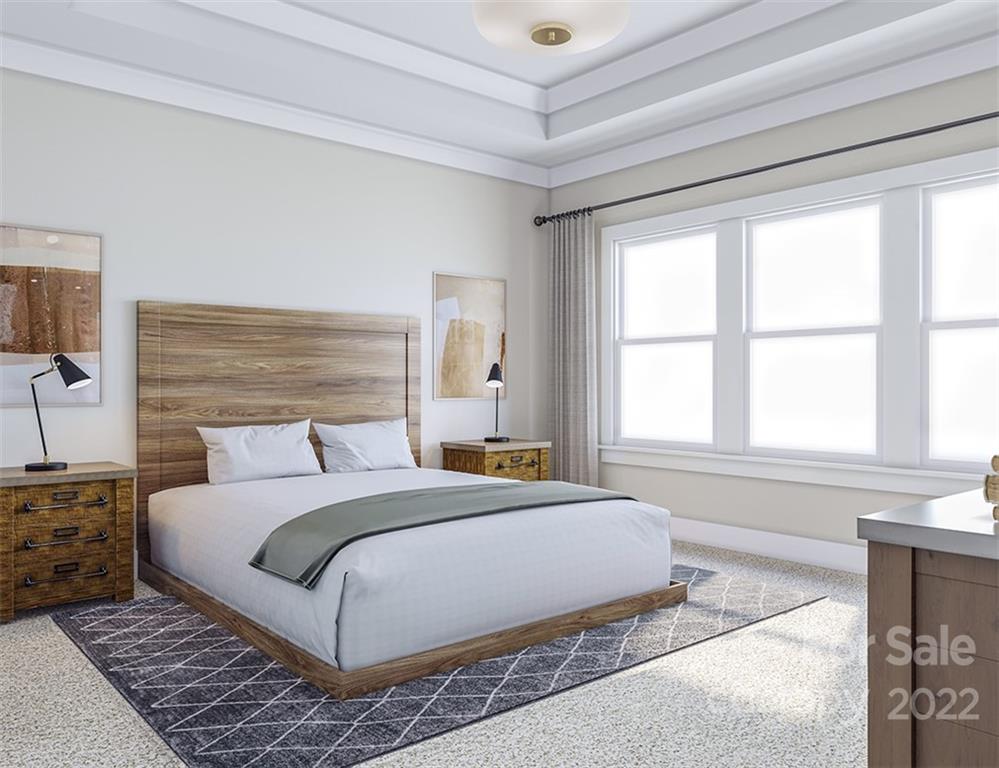 642 East Woodlawn Road Charlotte, NC 28209 - Photo 15 of 27 a bedroom with a large bed and a window