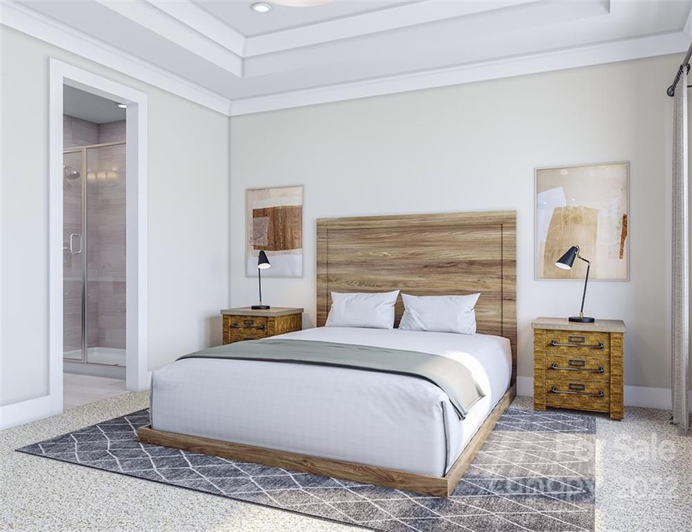 642 East Woodlawn Road Charlotte, NC 28209 - Photo 16 of 27 a bedroom with a bed a mirror and lamp