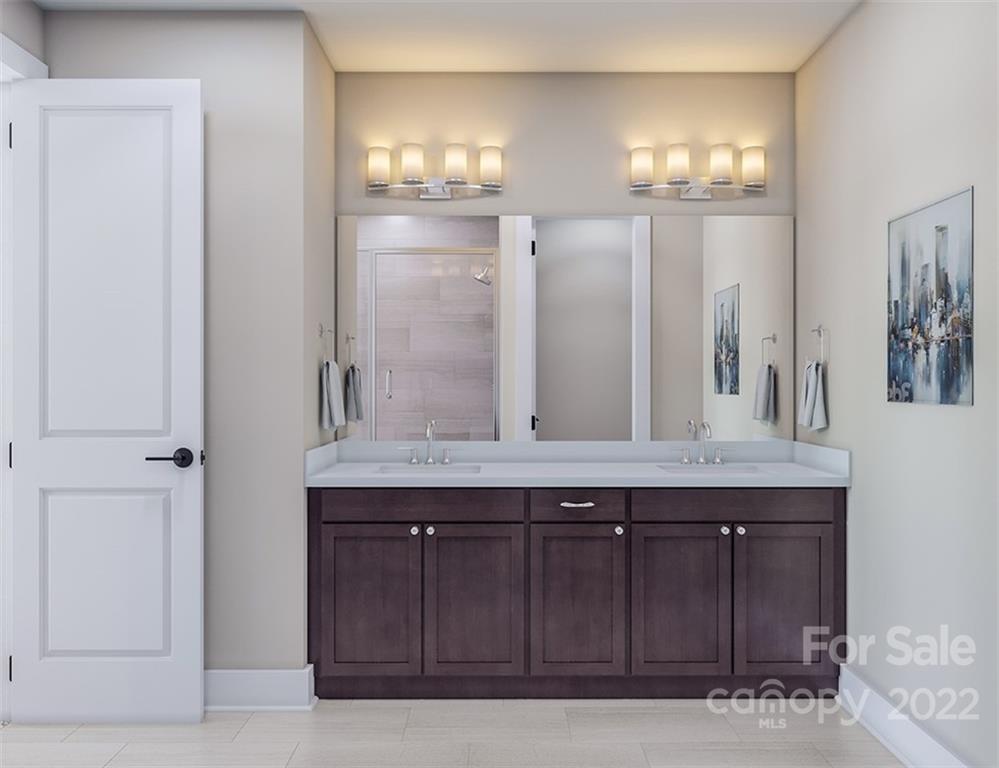 642 East Woodlawn Road Charlotte, NC 28209 - Photo 17 of 27 a bathroom with a granite countertop sink and a mirror