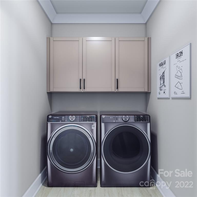 642 East Woodlawn Road Charlotte, NC 28209 - Photo 19 of 27 a utility room with sink dryer and washer