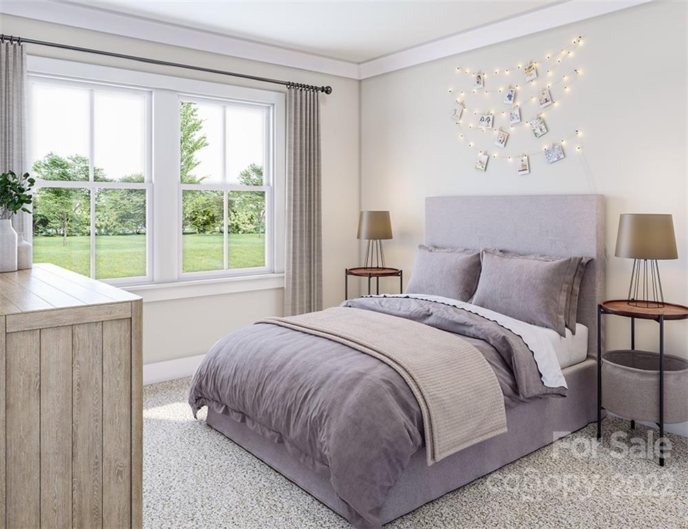 642 East Woodlawn Road Charlotte, NC 28209 - Photo 3 of 27 a bedroom with a bed and a painting on the wall