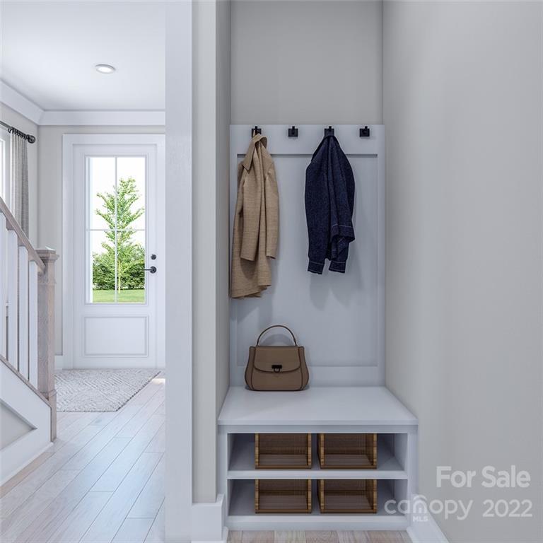 642 East Woodlawn Road Charlotte, NC 28209 - Photo 5 of 27 a view of walk in closet with clothes and shoes