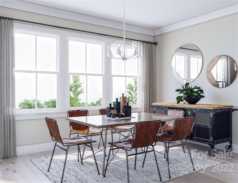 642 East Woodlawn Road Charlotte, NC 28209 - Photo 7 of 27 a view of a dining room with furniture window and wooden floor