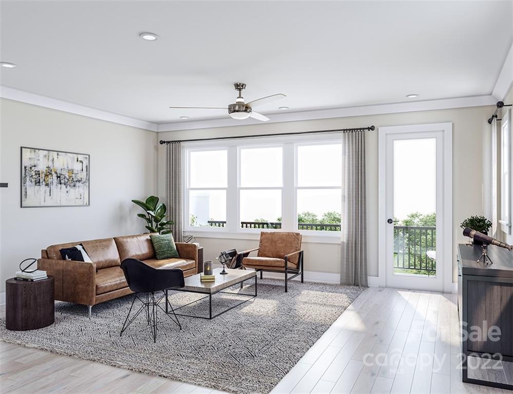 642 East Woodlawn Road Charlotte, NC 28209 - Photo 8 of 27 a living room with furniture and a large window