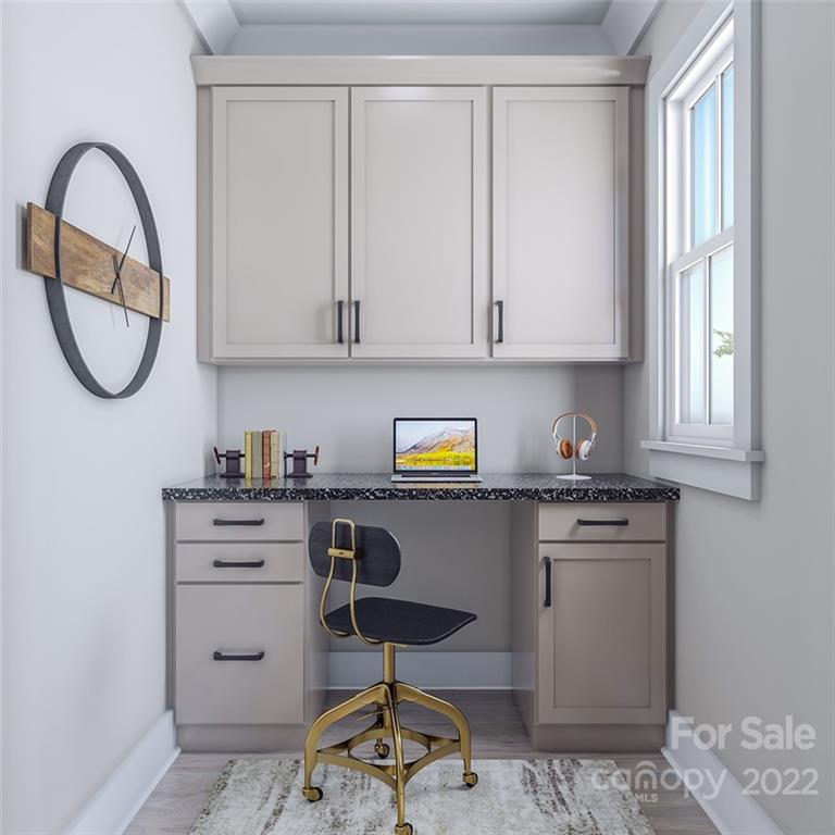 642 East Woodlawn Road Charlotte, NC 28209 - Photo 10 of 27 a kitchen with stainless steel appliances granite countertop a stove a sink and a white wooden cabinets