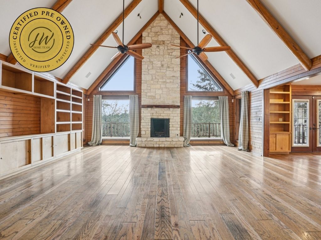 19801 Adrian Way Jonestown, TX 78645 - Photo 1 of 29 a view of an empty room with a window and wooden floor