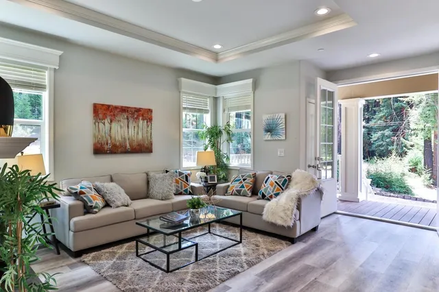 a dining room with furniture a chandelier and window