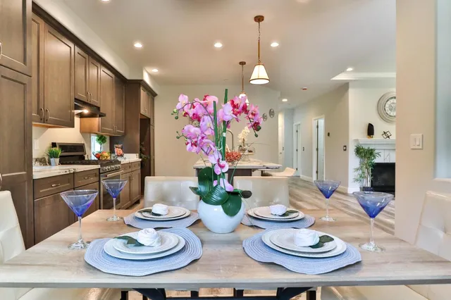 a bathroom with a granite countertop sink a large mirror and a shower