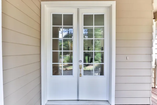 a living room with furniture a fireplace and window
