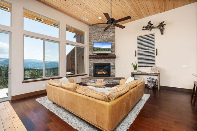a living room with furniture fireplace and flat screen tv