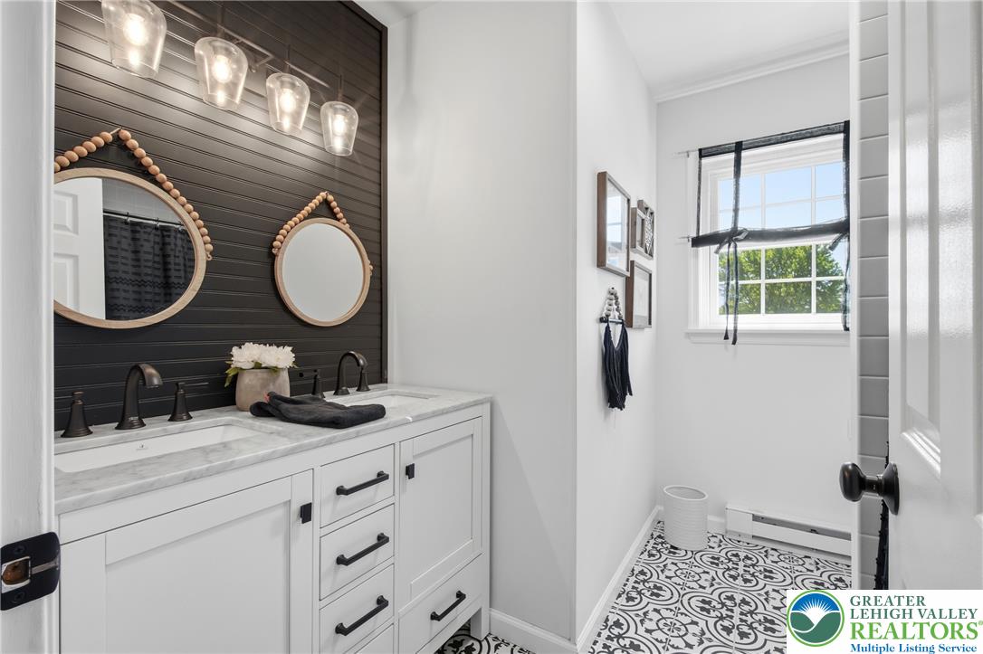 890 Lahr Road Nazareth, PA 18064 - Photo 30 of 71 Dual vanity with elegant marble counters and striking patterned tile flooring defines this bath.