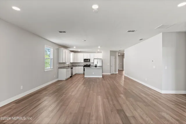 a view of kitchen with wooden floor