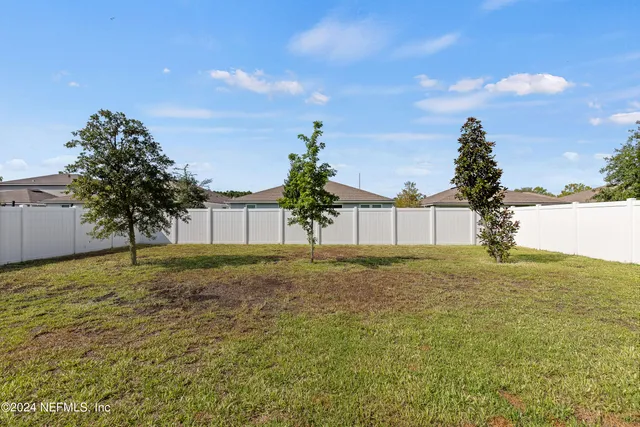 a view of a yard with an outdoor space