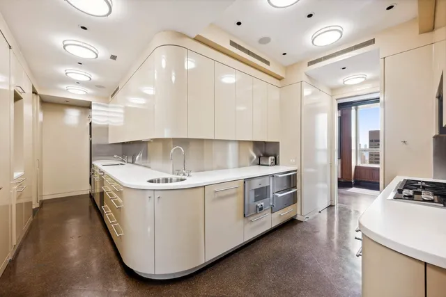 a view of washer and dryer with kitchen view