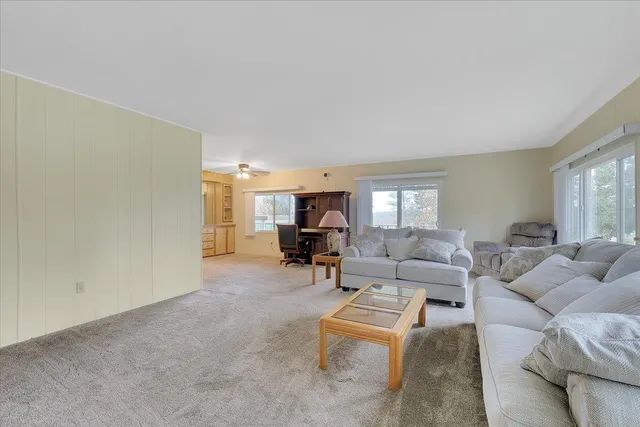 a living room with furniture and a gym