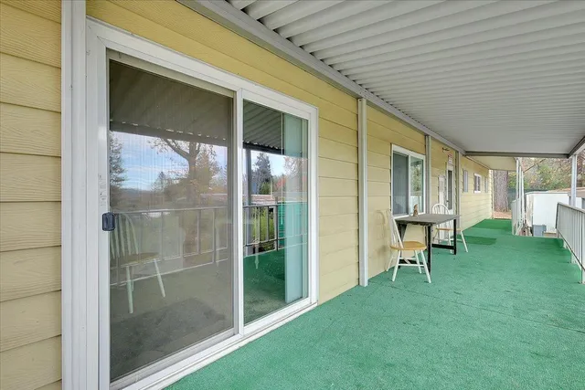 a view of backyard with a garden and chairs