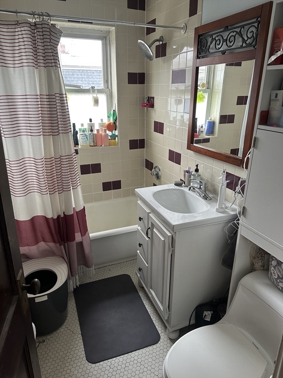 38 Day Street, Unit 20 Somerville, MA 02144 - Photo 5 of 9 a bathroom with a sink toilet and shower