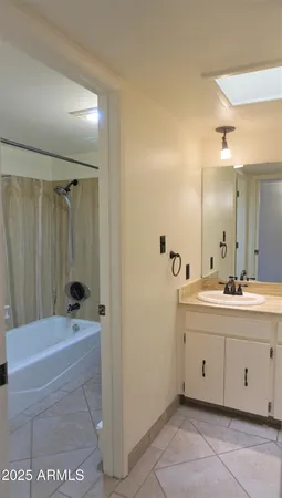 a view of a backyard with plants and outdoor seating