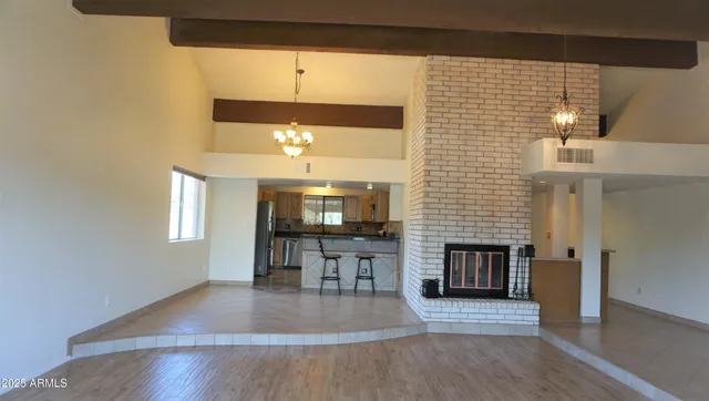 an entryway with fireplace and wooden floor