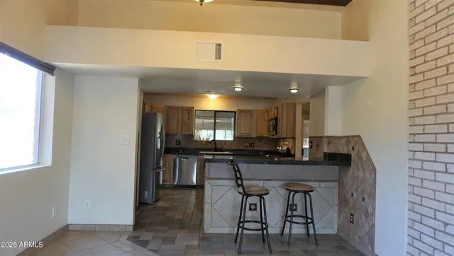 a kitchen with a table and chairs in it