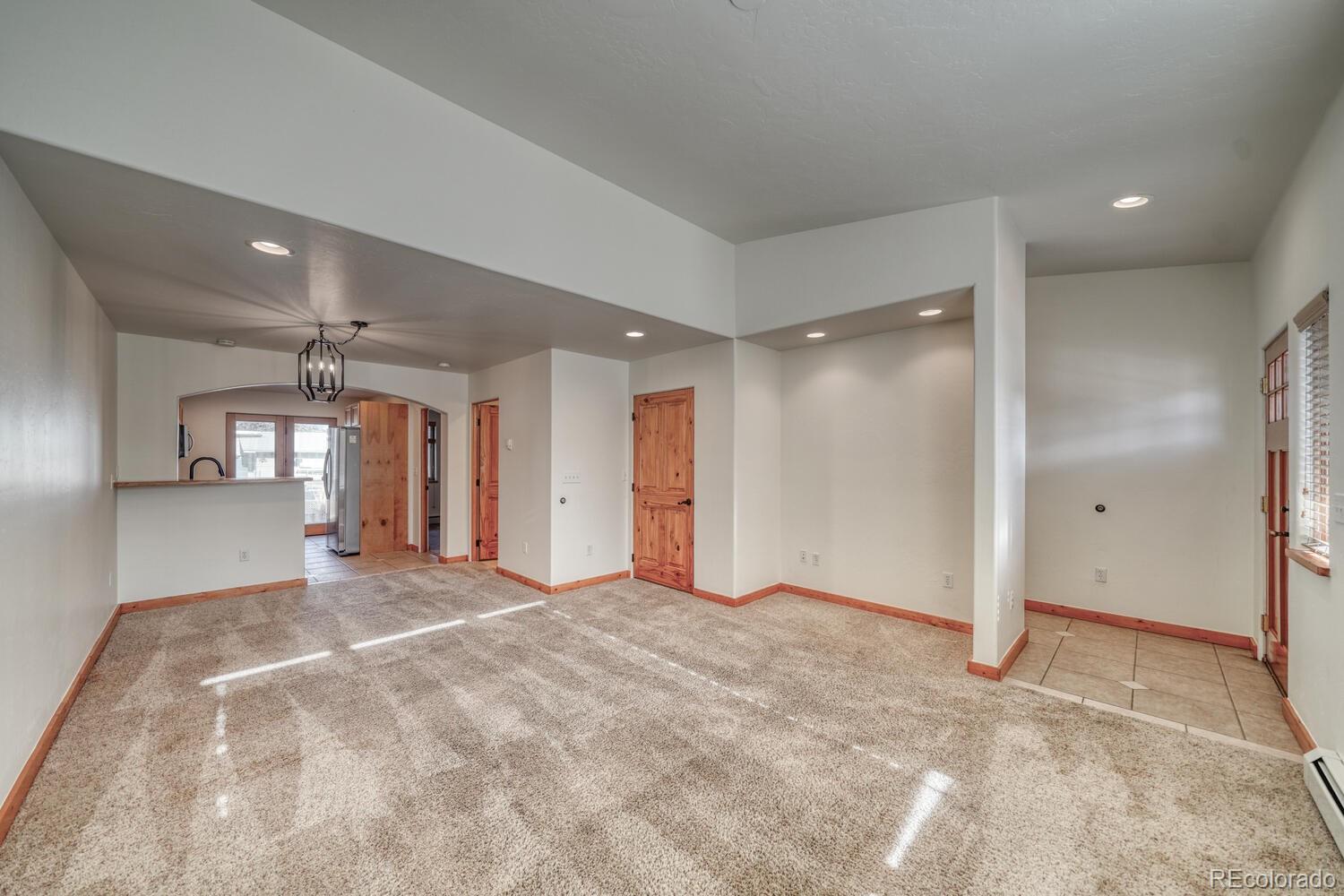 138 North M Street, Unit C Salida, CO 81201 - Photo 6 of 47 a view of empty room with windows and ceiling fan