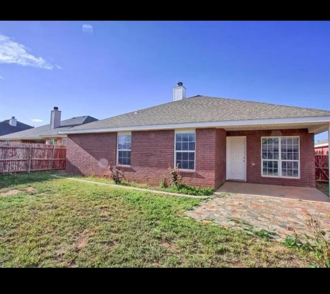 6821 84th Street Lubbock, TX 79424 - Photo 14 of 14 a view of a house with a backyard