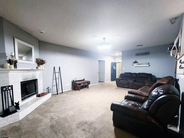 6821 84th Street Lubbock, TX 79424 - Photo 2 of 14 a living room with furniture and a fireplace