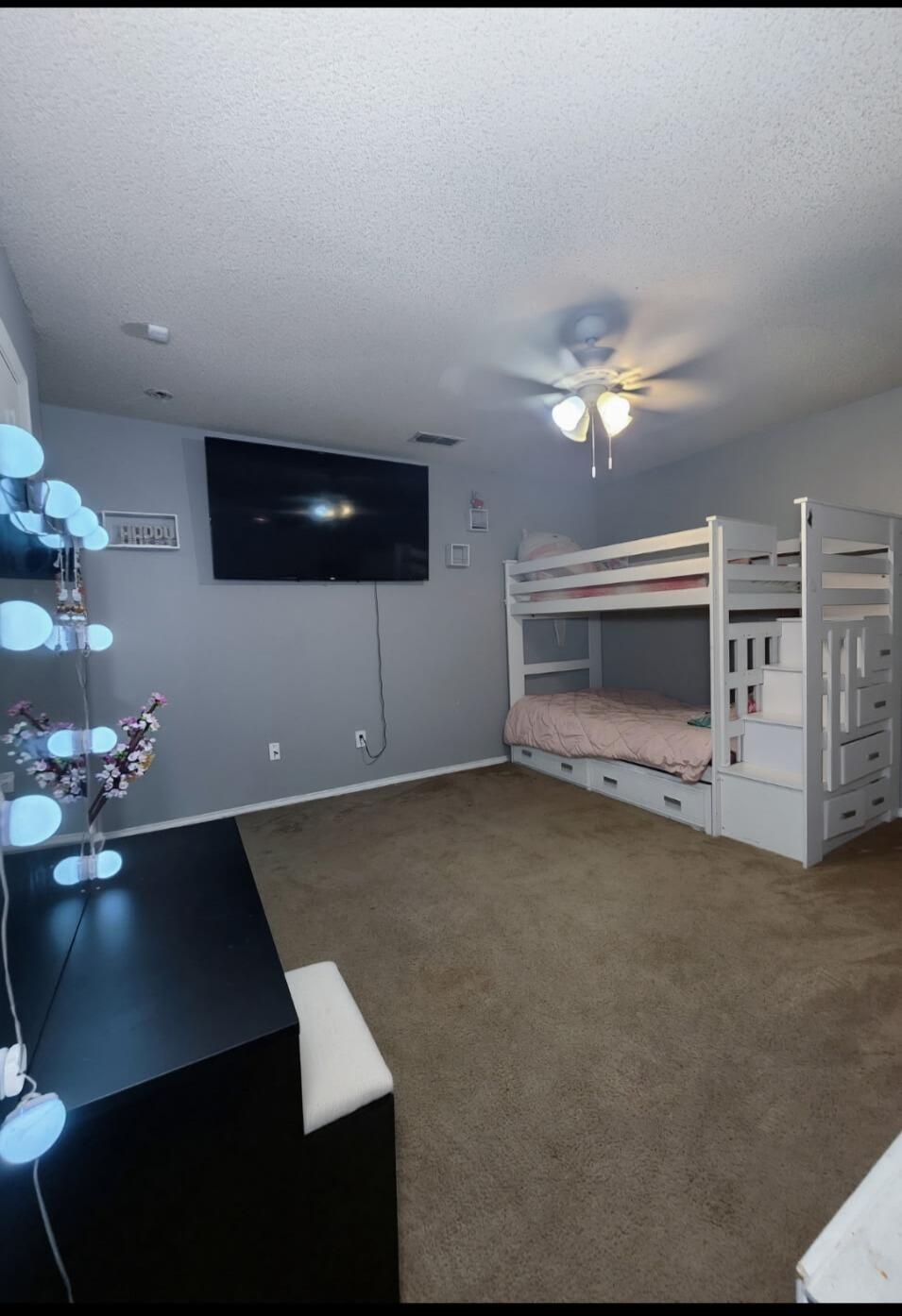 6821 84th Street Lubbock, TX 79424 - Photo 8 of 14 a living room with furniture and a flat screen tv