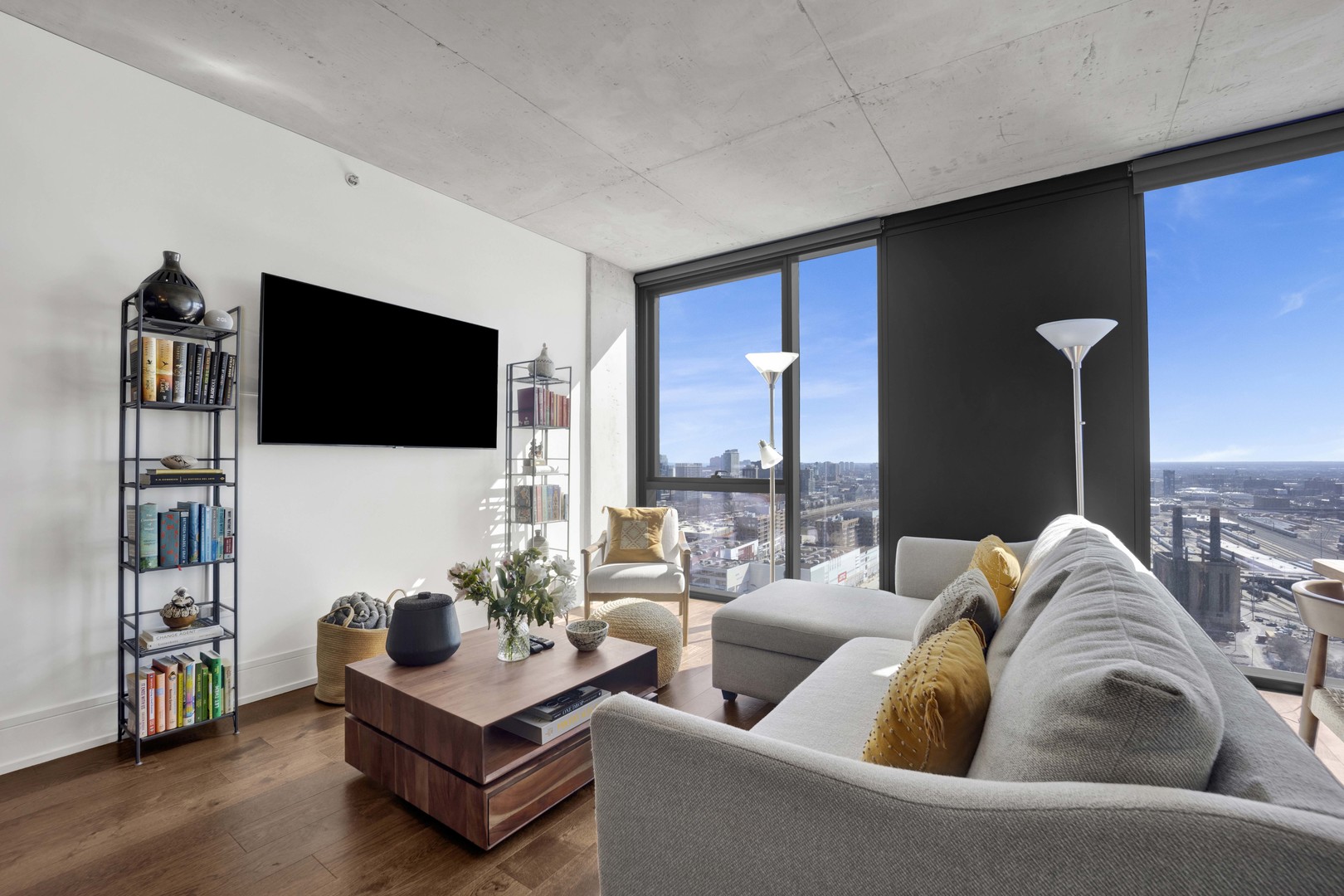 234 West Polk Street, Unit 2903 Chicago, IL 60607 - Photo 3 of 39 a living room with furniture and a flat screen tv
