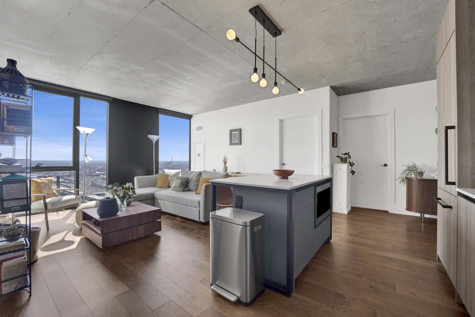 234 West Polk Street, Unit 2903 Chicago, IL 60607 - Photo 8 of 39 a living room with furniture and a wooden floor