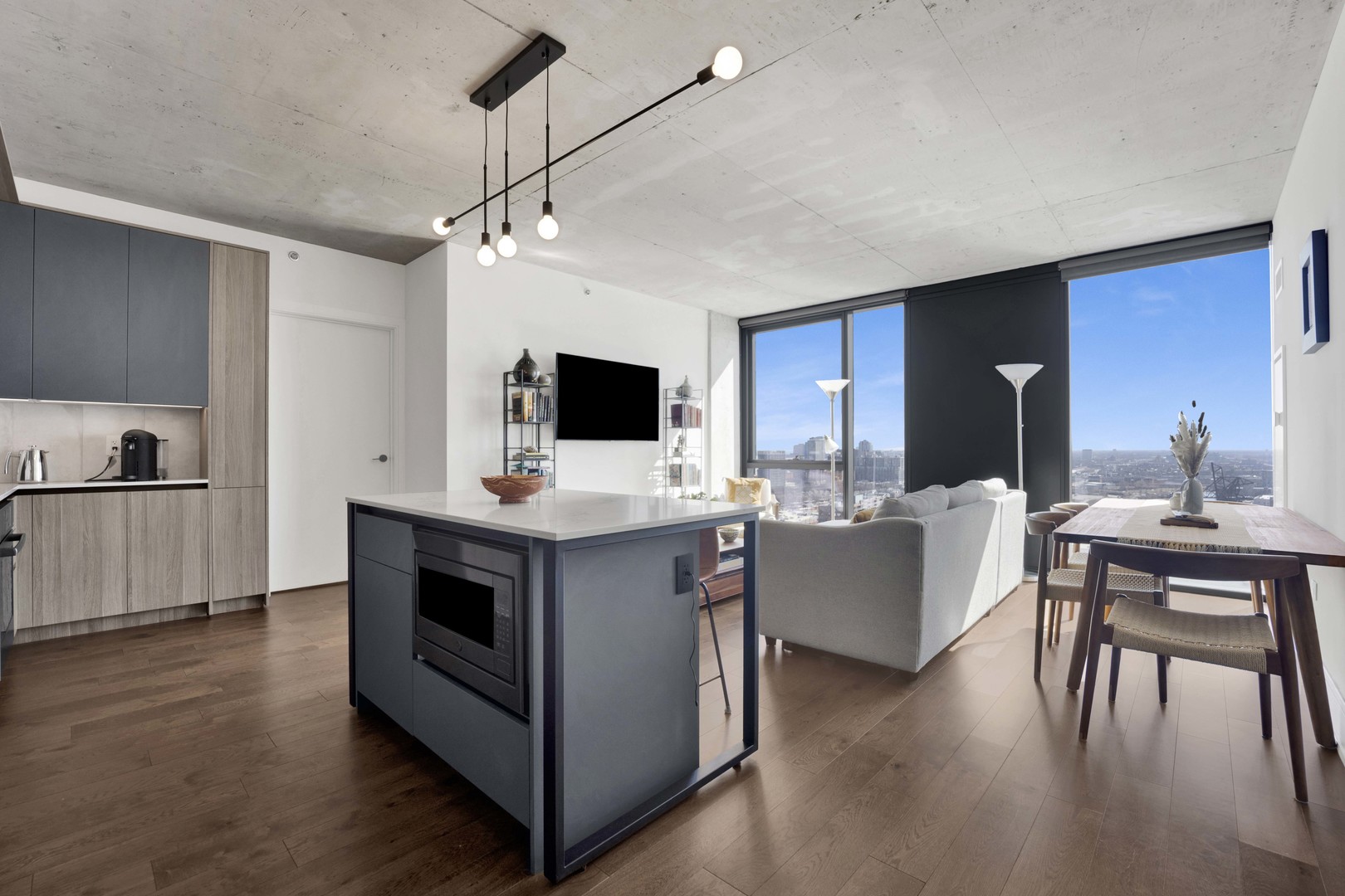 234 West Polk Street, Unit 2903 Chicago, IL 60607 - Photo 9 of 39 a living room with furniture and a flat screen tv