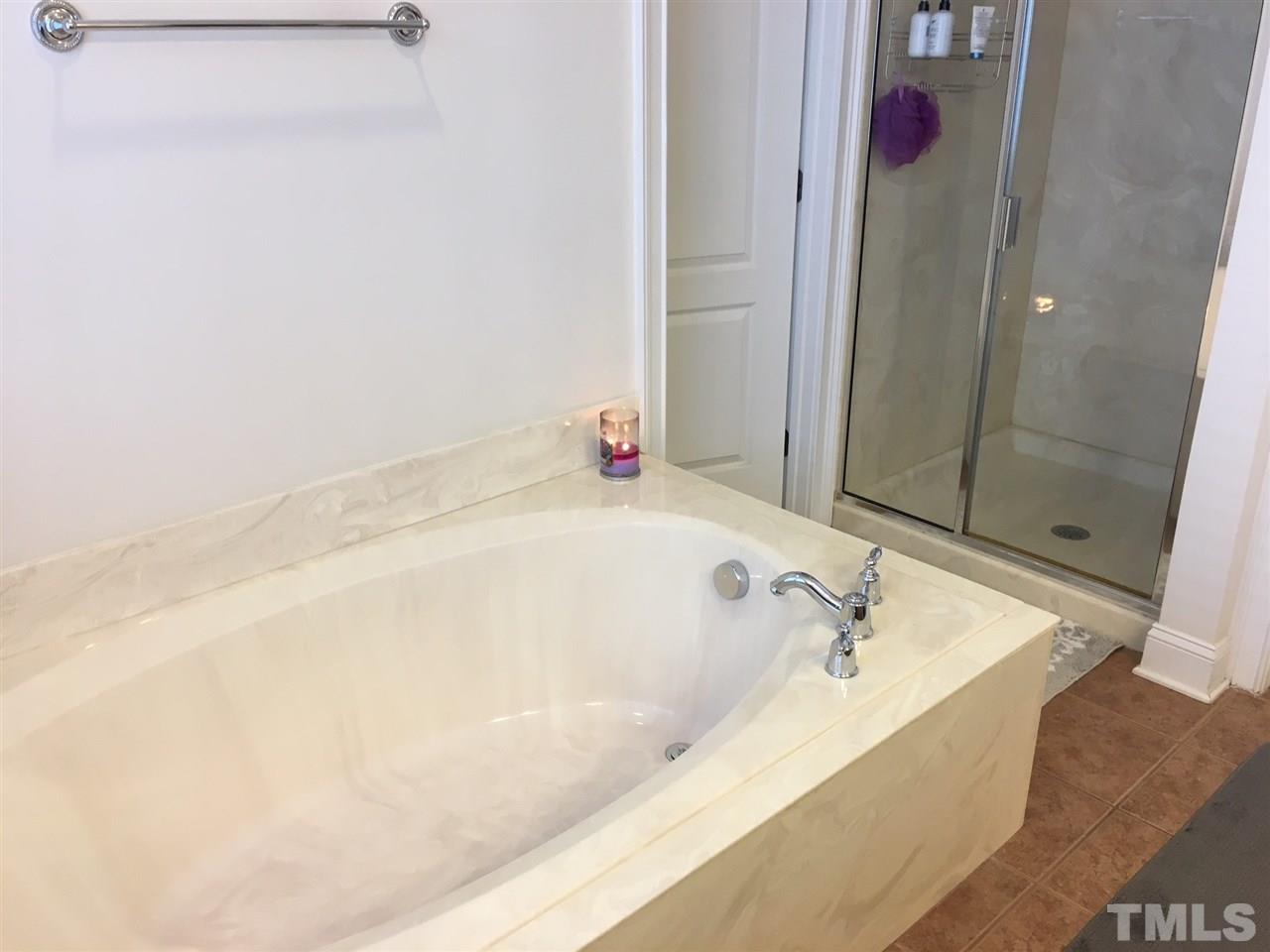 105 Fort Jackson Road Morrisville, NC 27560 - Photo 11 of 18 a bathroom with a bathtub and shower