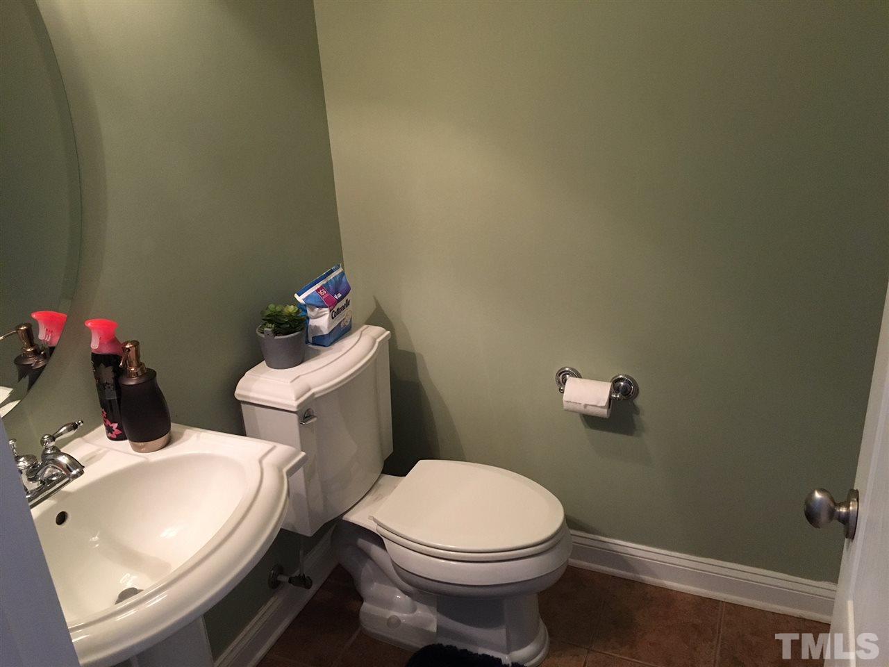 105 Fort Jackson Road Morrisville, NC 27560 - Photo 7 of 18 a white toilet sitting next to a bathroom sink