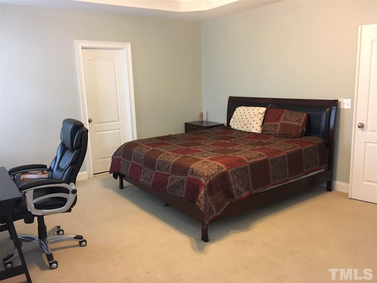 105 Fort Jackson Road Morrisville, NC 27560 - Photo 8 of 18 a bedroom with a bed chair and a desk