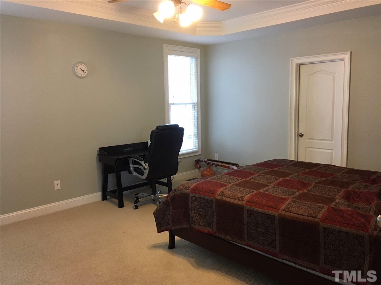 105 Fort Jackson Road Morrisville, NC 27560 - Photo 9 of 18 a bedroom with a bed and a window