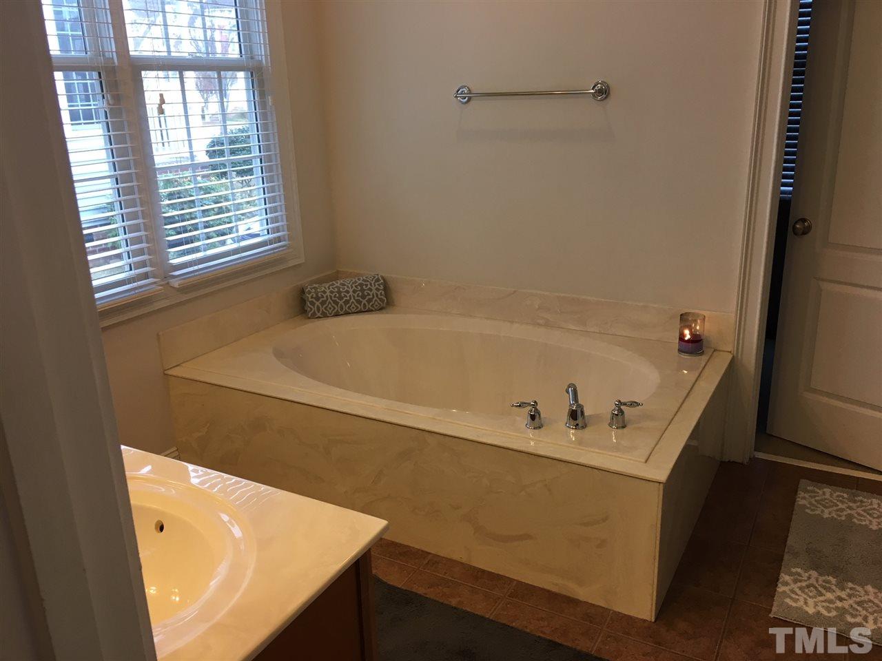 105 Fort Jackson Road Morrisville, NC 27560 - Photo 10 of 18 a bathroom with a tub and a window
