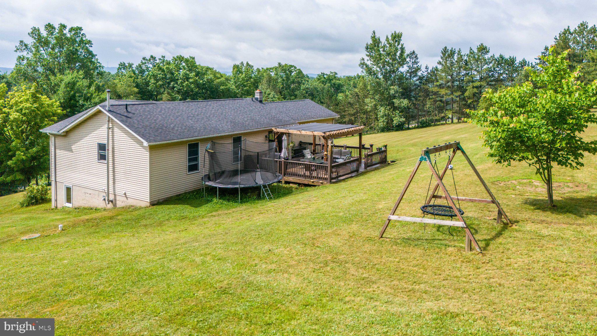 595 Pysell Crosscut Road Oakland, MD 21550 - Photo 7 of 61 Serene backyard retreat with play area.