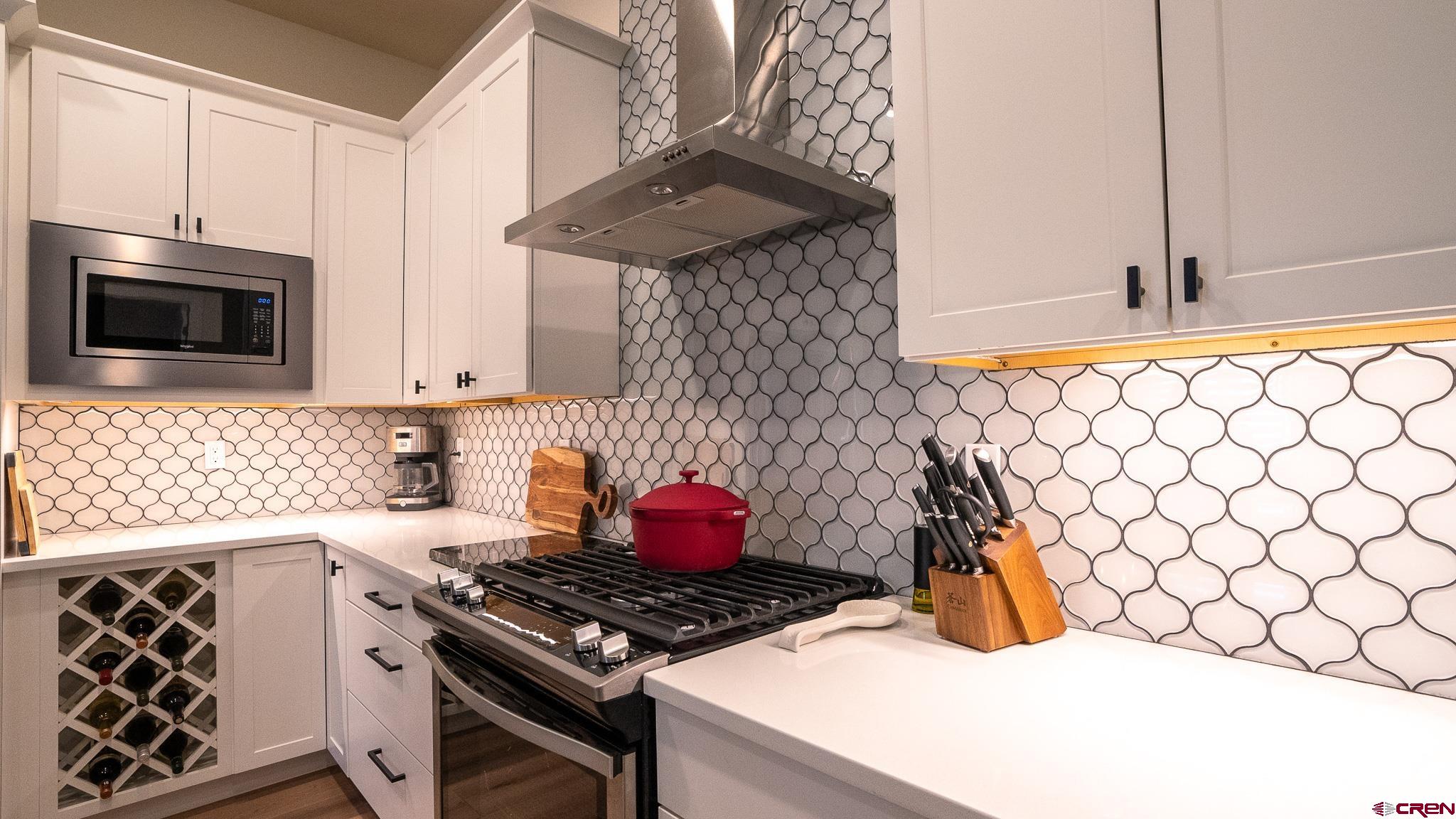 236 Via Tuscana Durango, CO 81301 - Photo 11 of 31 a kitchen with a stove and a microwave