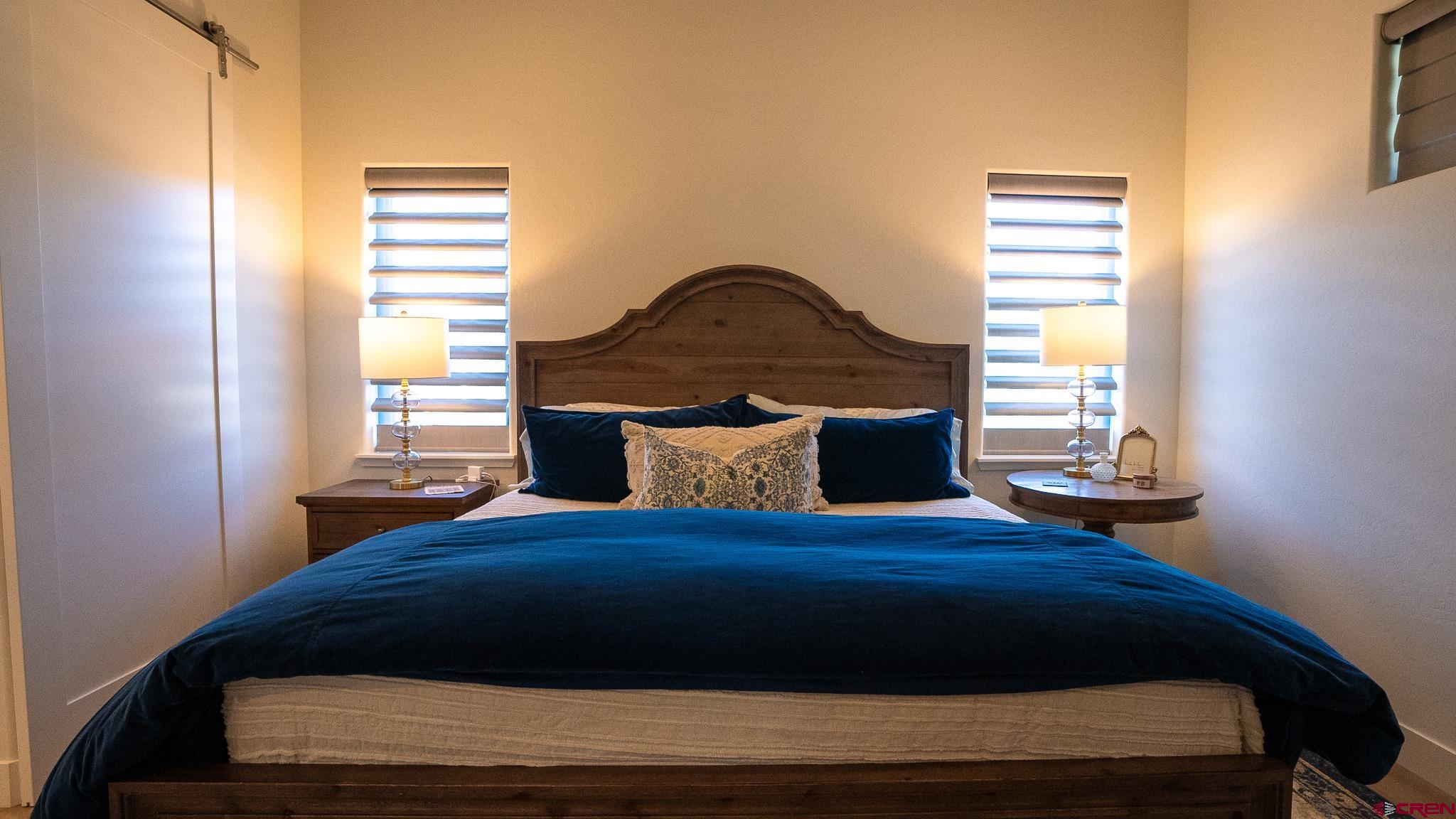 236 Via Tuscana Durango, CO 81301 - Photo 14 of 31 a bedroom with a bed and window