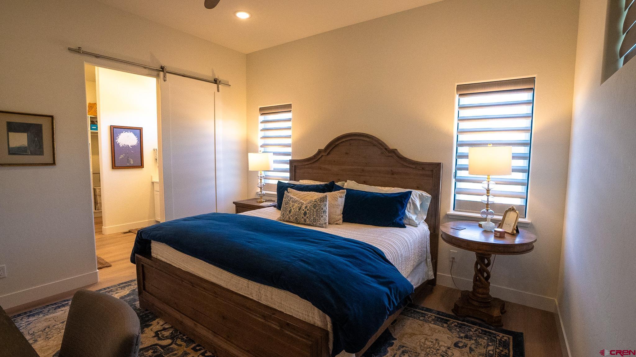 236 Via Tuscana Durango, CO 81301 - Photo 15 of 31 a bedroom with a bed and a window