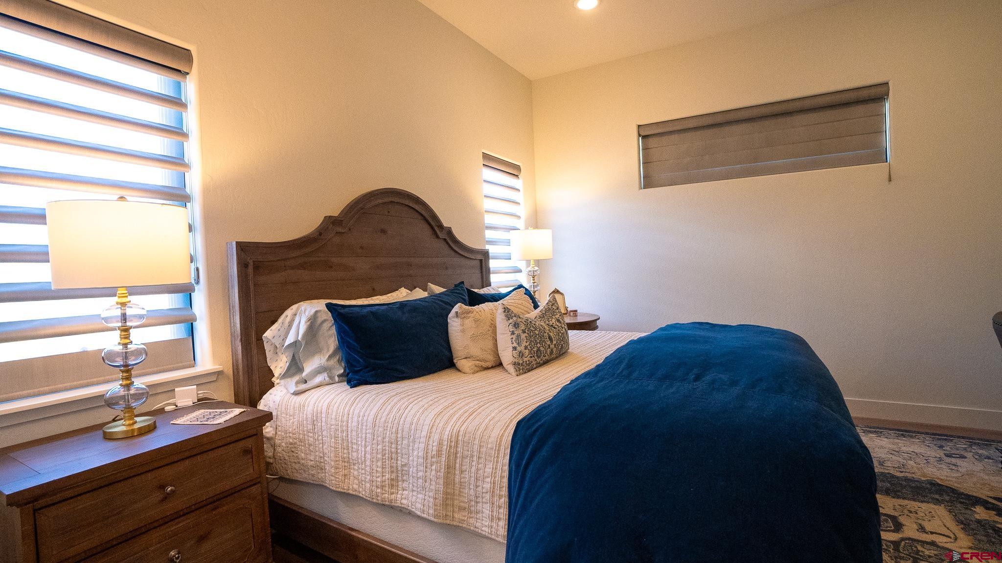 236 Via Tuscana Durango, CO 81301 - Photo 16 of 31 a bedroom with a bed and a window