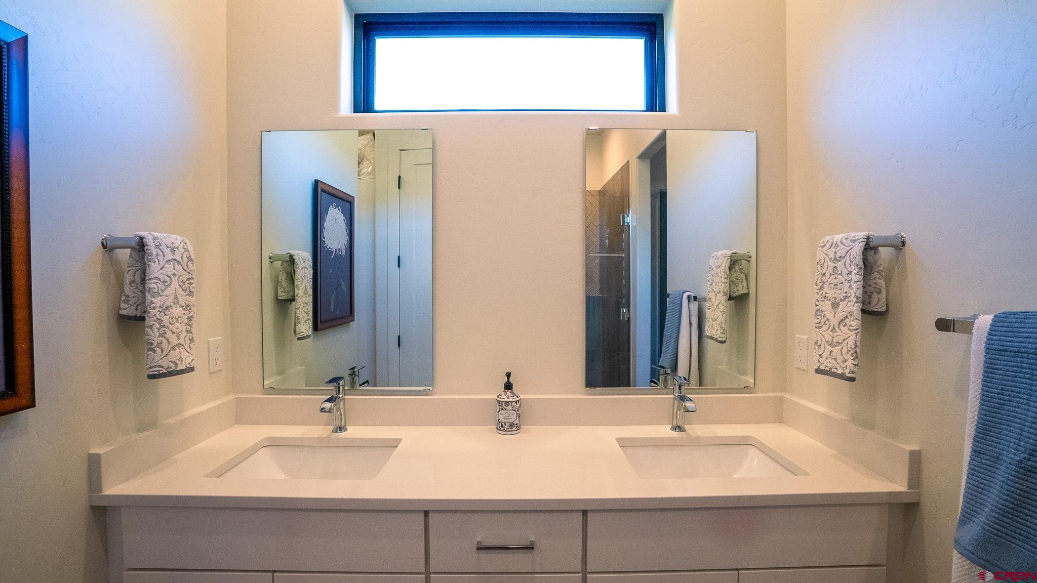 236 Via Tuscana Durango, CO 81301 - Photo 18 of 31 a bathroom with double vanity sink and a mirror