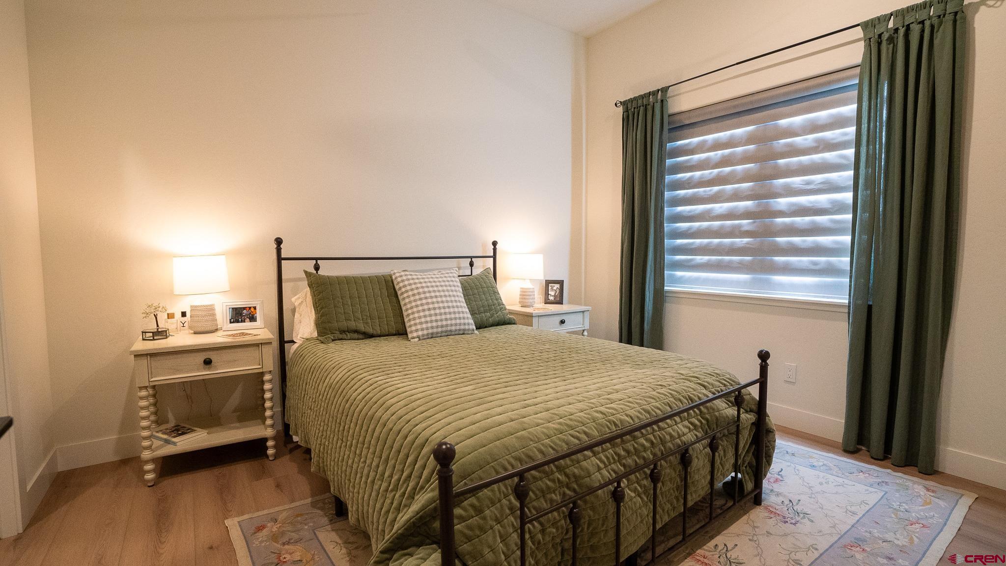 236 Via Tuscana Durango, CO 81301 - Photo 21 of 31 a bedroom with a bed and a window