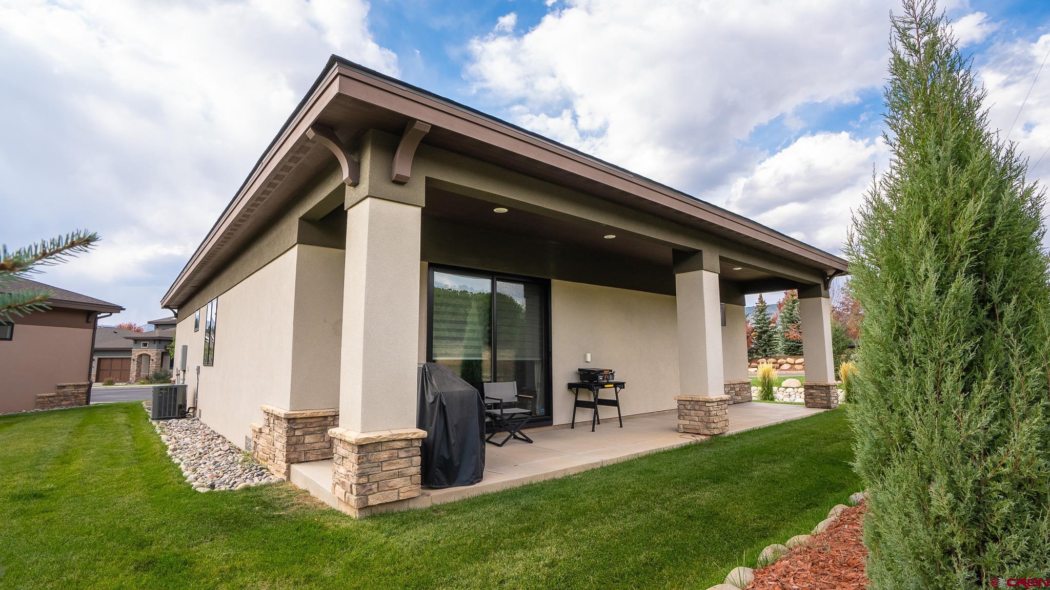 236 Via Tuscana Durango, CO 81301 - Photo 28 of 31 a backyard of a house with table and chairs