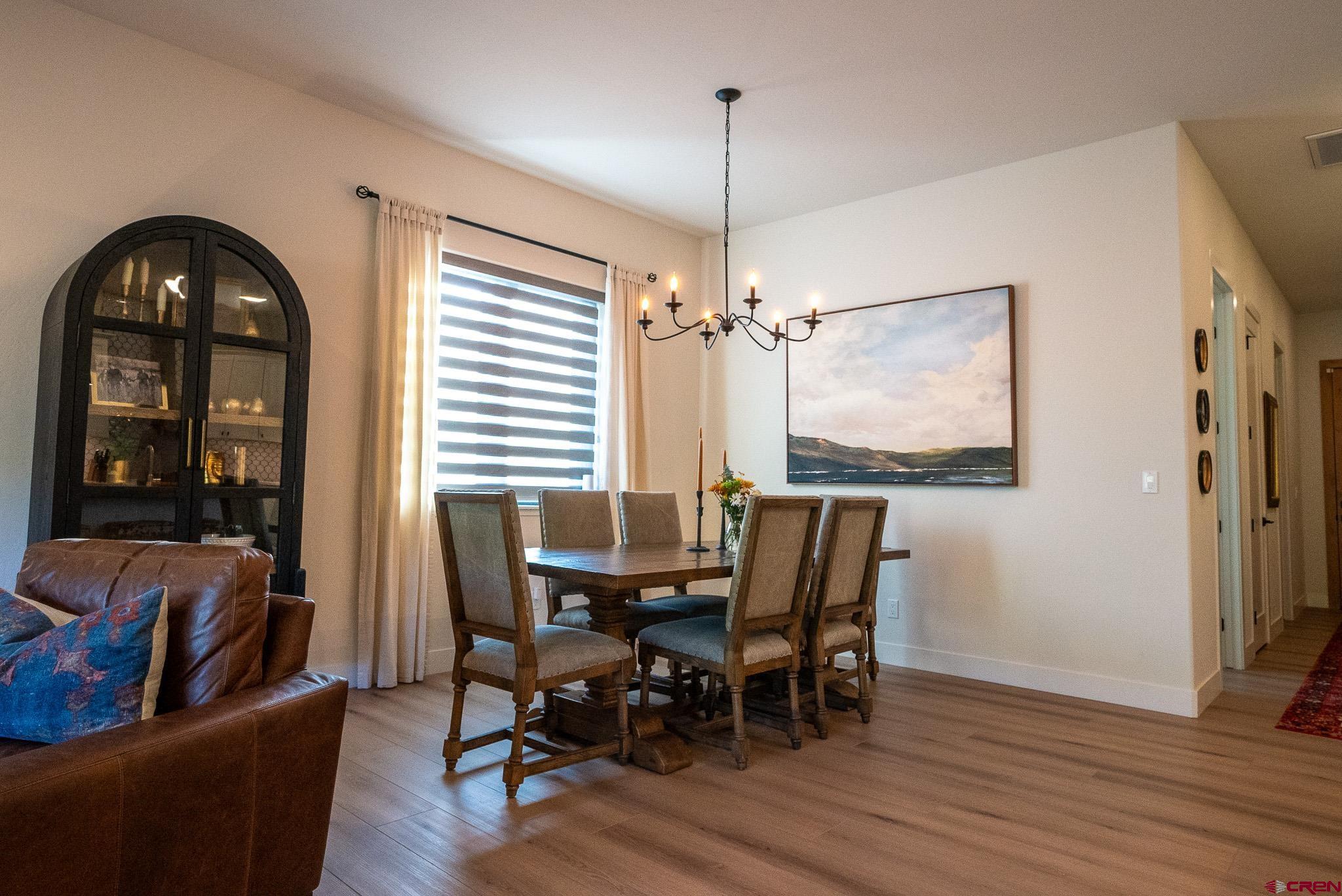 236 Via Tuscana Durango, CO 81301 - Photo 4 of 31 a view of a dining room with furniture window and wooden floor