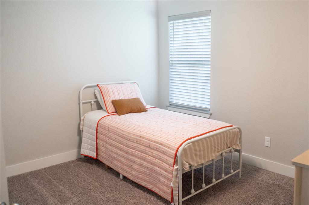 7909 Townsend Drive Waco, TX 76708 - Photo 15 of 22 Neutral-toned wall paint with a single window featuring horizontal blinds