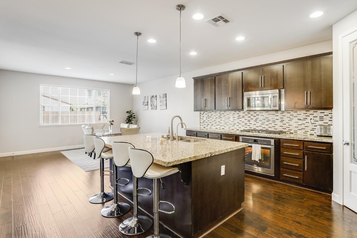 333 Calle Cerro Morgan Hill, CA 95037 - Photo 12 of 45 a large kitchen with lots of counter space and a sink