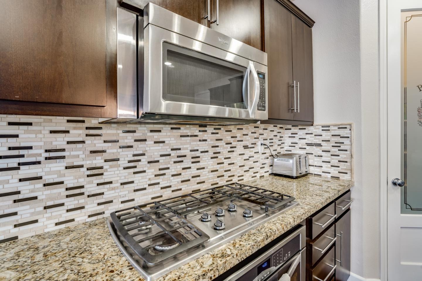 333 Calle Cerro Morgan Hill, CA 95037 - Photo 14 of 45 a bathroom with a sink a stove and granite top
